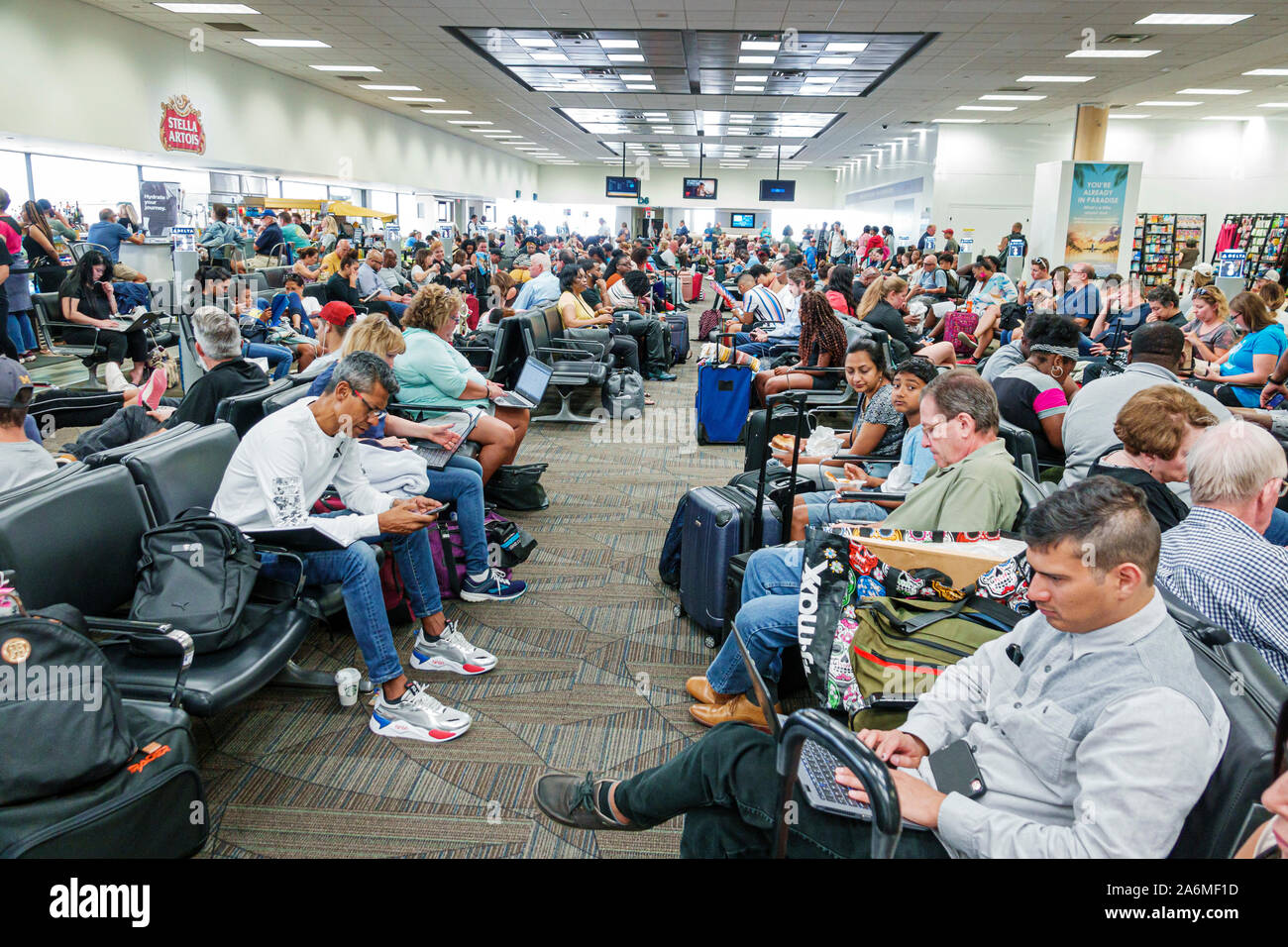 Fort Ft. Lauderdale Florida,Fort Lauderdale-Hollywood International Airport FLL,Terminal 2,inside,passenger gate,seating,crowded,man,woman,luggage,FL1 Stock Photo