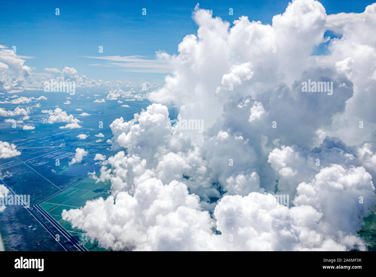 Fort Ft. Lauderdale Florida,window seat,aerial view,Everglades Wildlife Management Area,cumulus clouds,FL190819050 Stock Photo