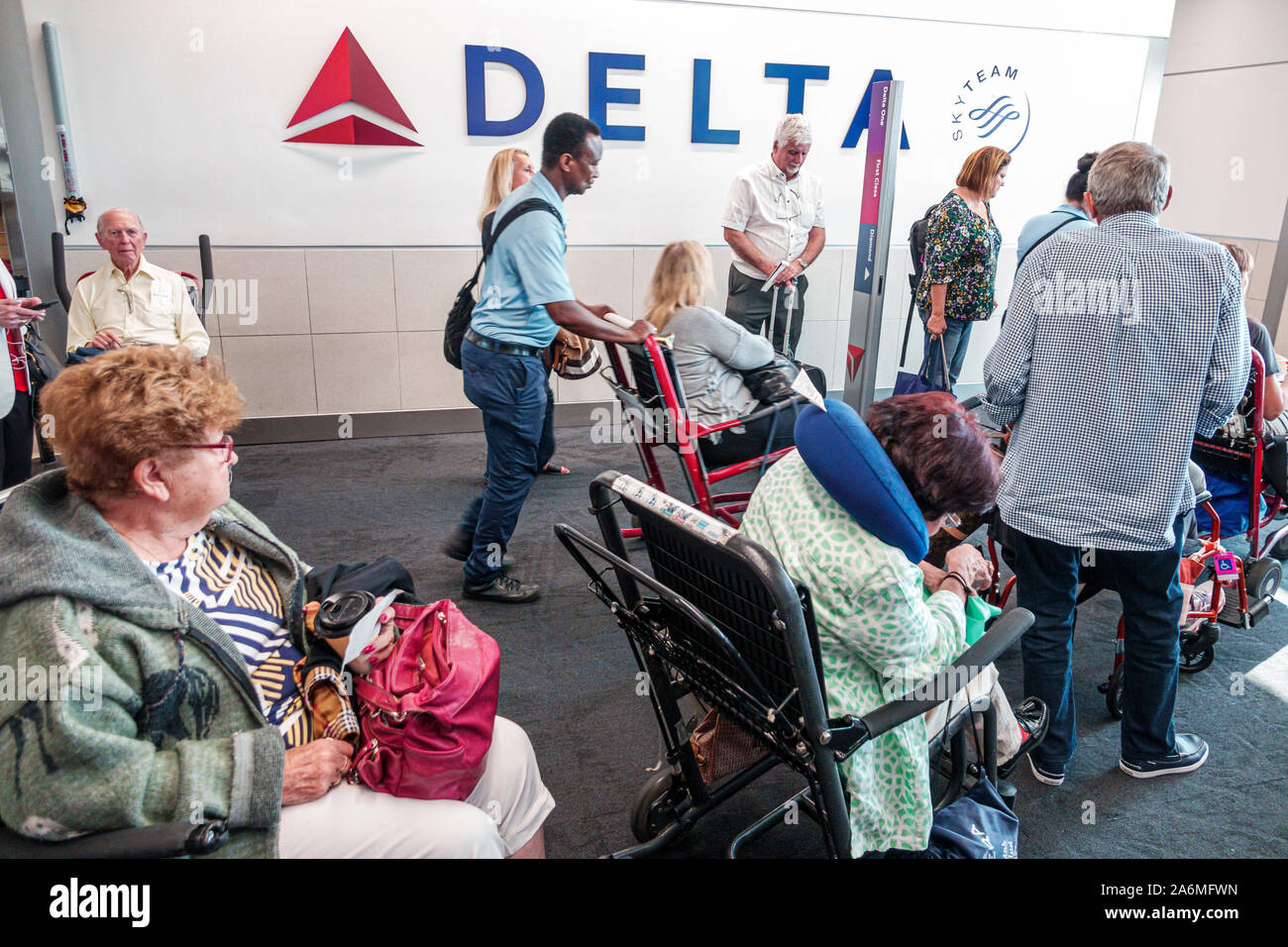 Georgia,Atlanta,Hartsfield-Jackson Atlanta International Airport,terminal,inside interior,gate,Delta Airlines,flight boarding,disabled disability hand Stock Photo