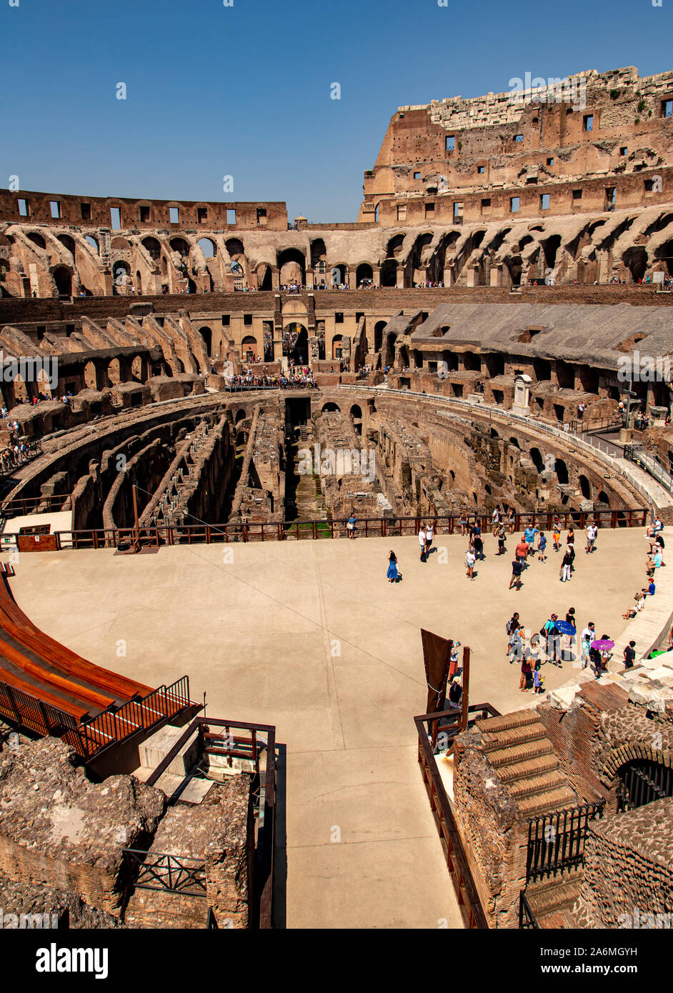 The interior of the Colosseum, Rome showing the replaced portion of floor,  the channels of the underground hypogeum and the original siting of the  tiered seating Stock Photo - Alamy