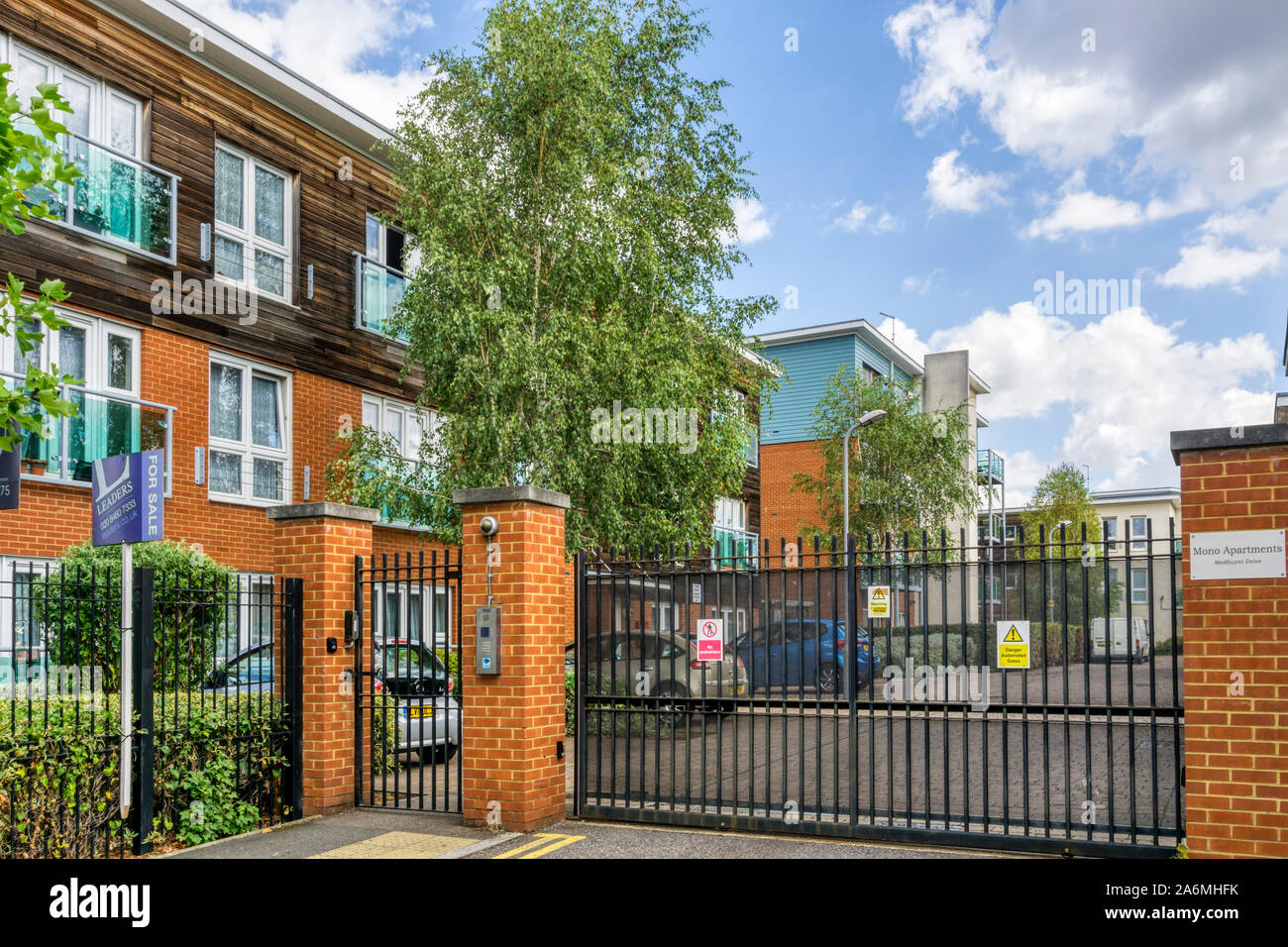 A gated estate in South London with the electronic gate closed. Stock Photo