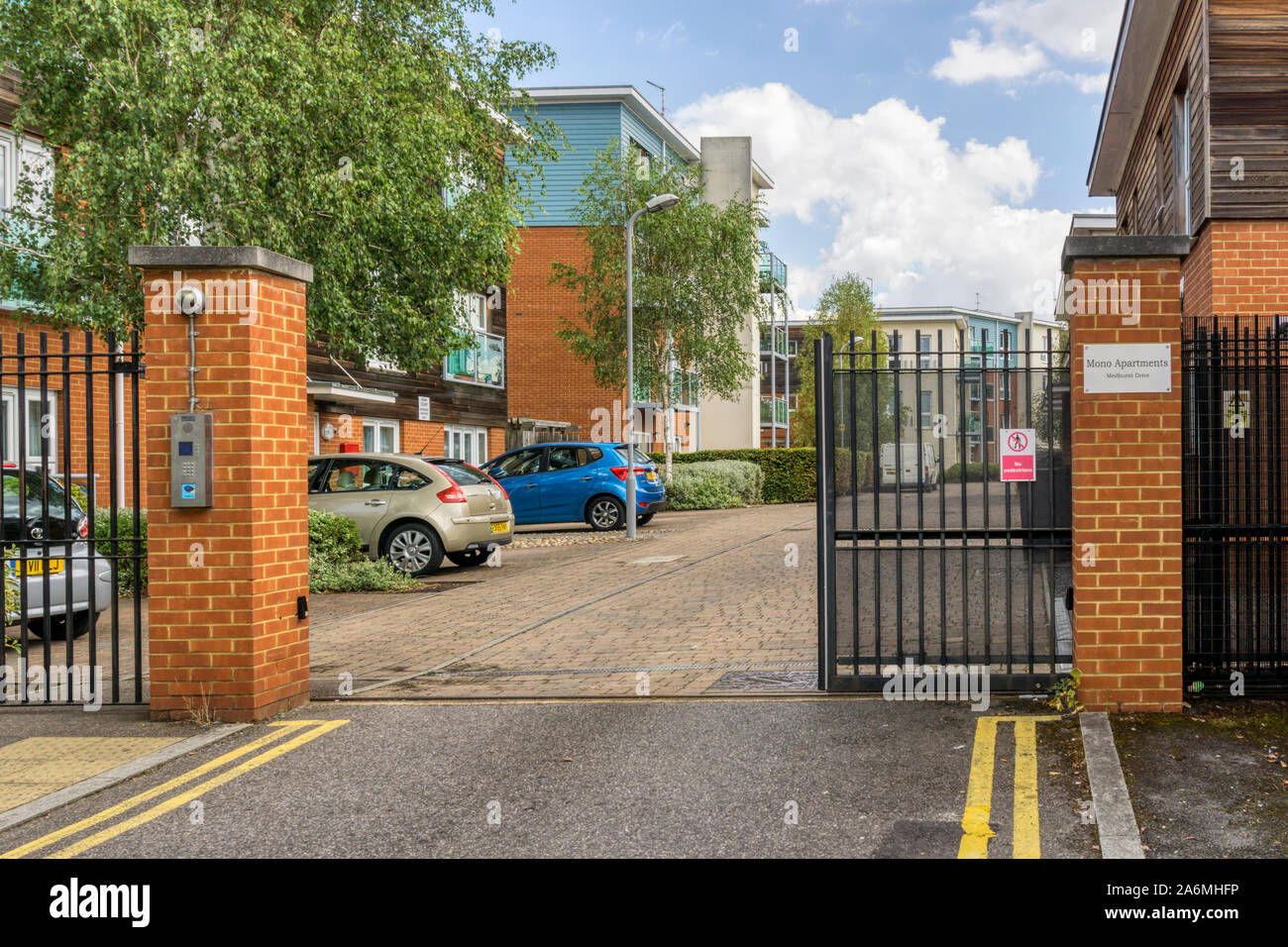 A gated estate in South London with the electronic gate open. Stock Photo