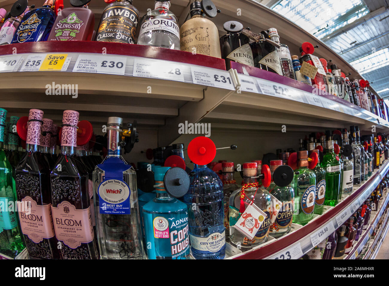 Selection of Gins on Supermarket Shelves Stock Photo