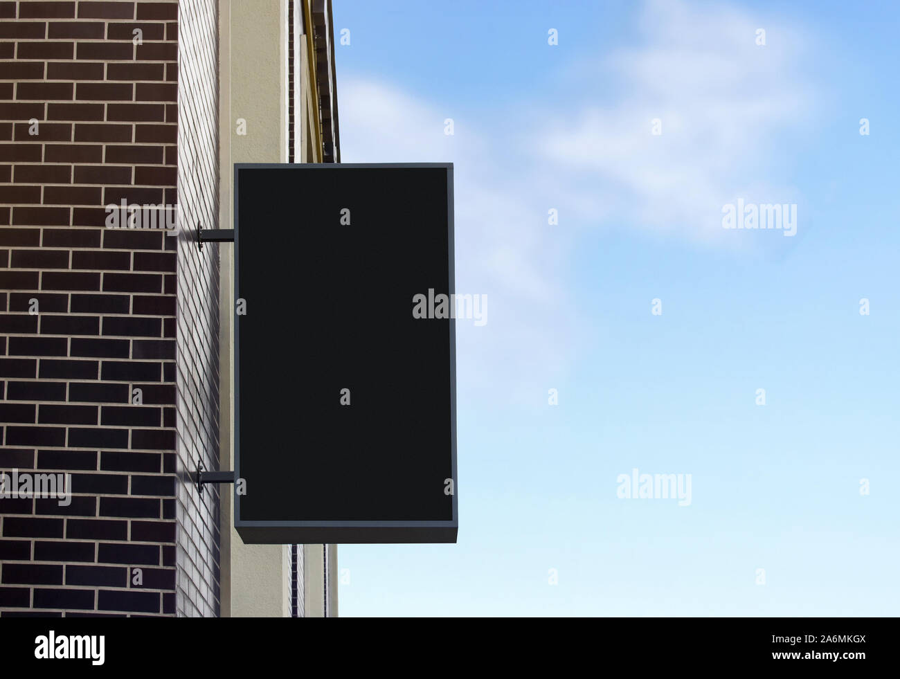 Blank black light box mockup on brick wall, sky background Stock Photo