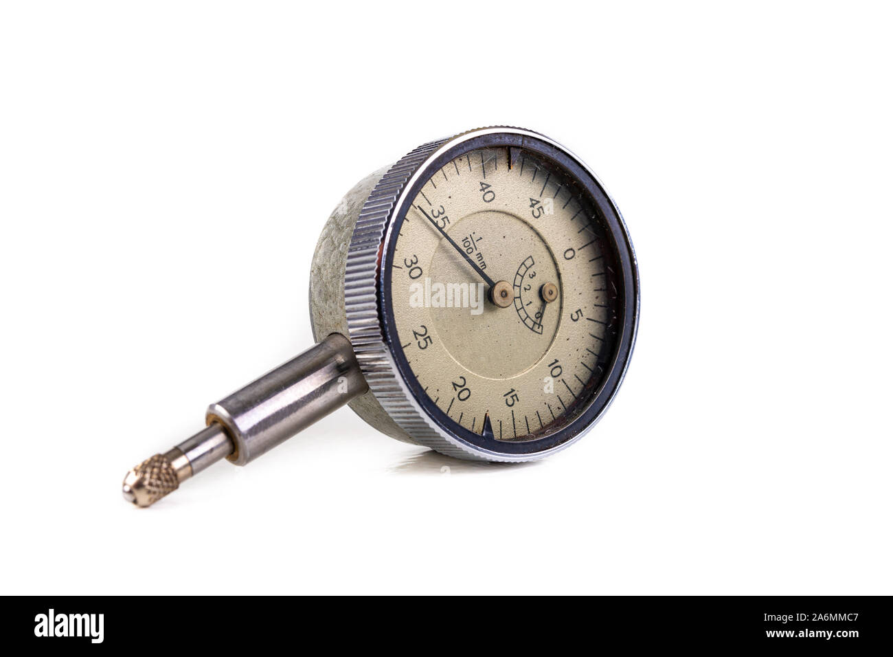 Dial indicator on a white table. Measuring tools used in the workshop ...