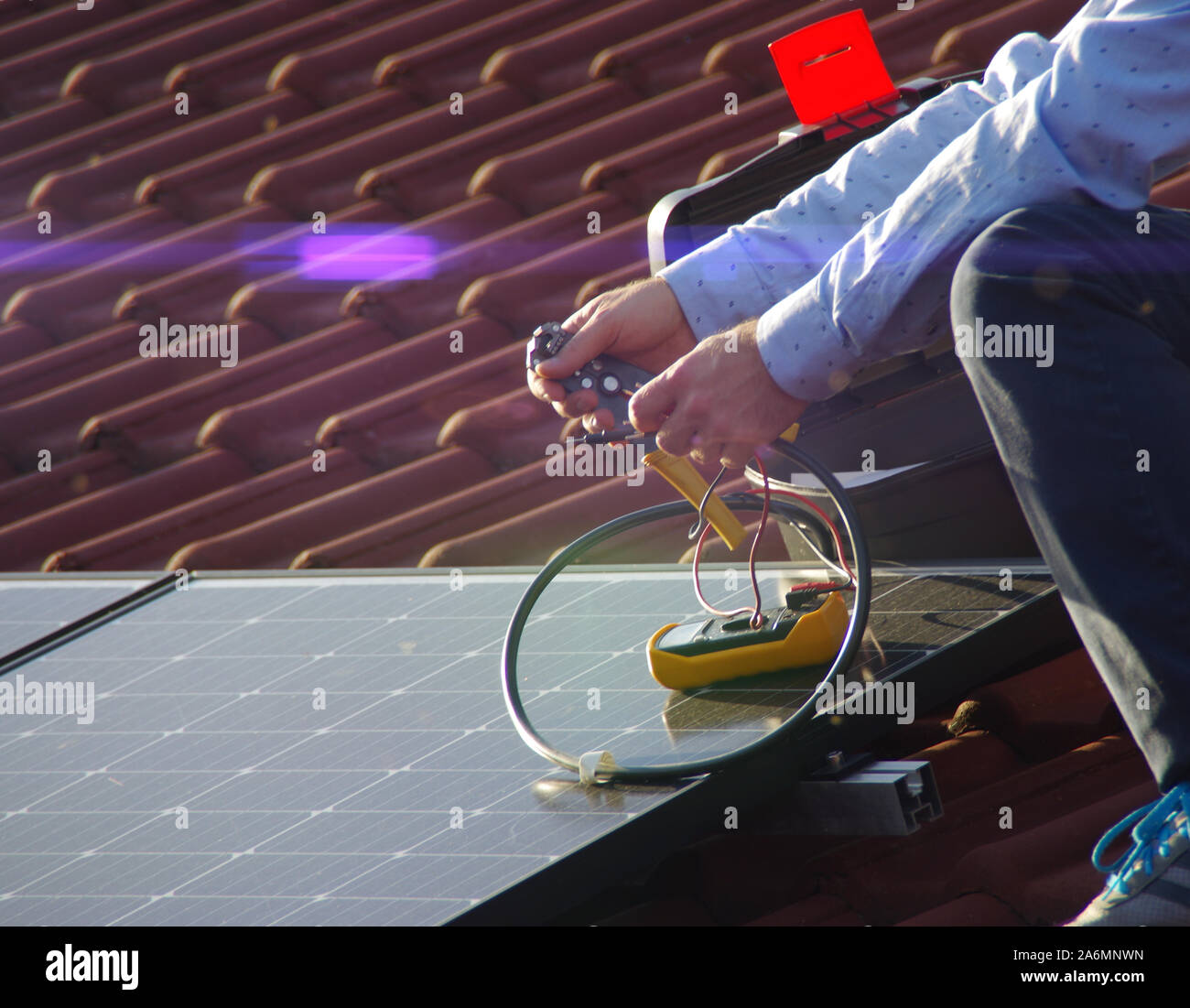 Assembly, installation and checking of solar panels on the house roof ...