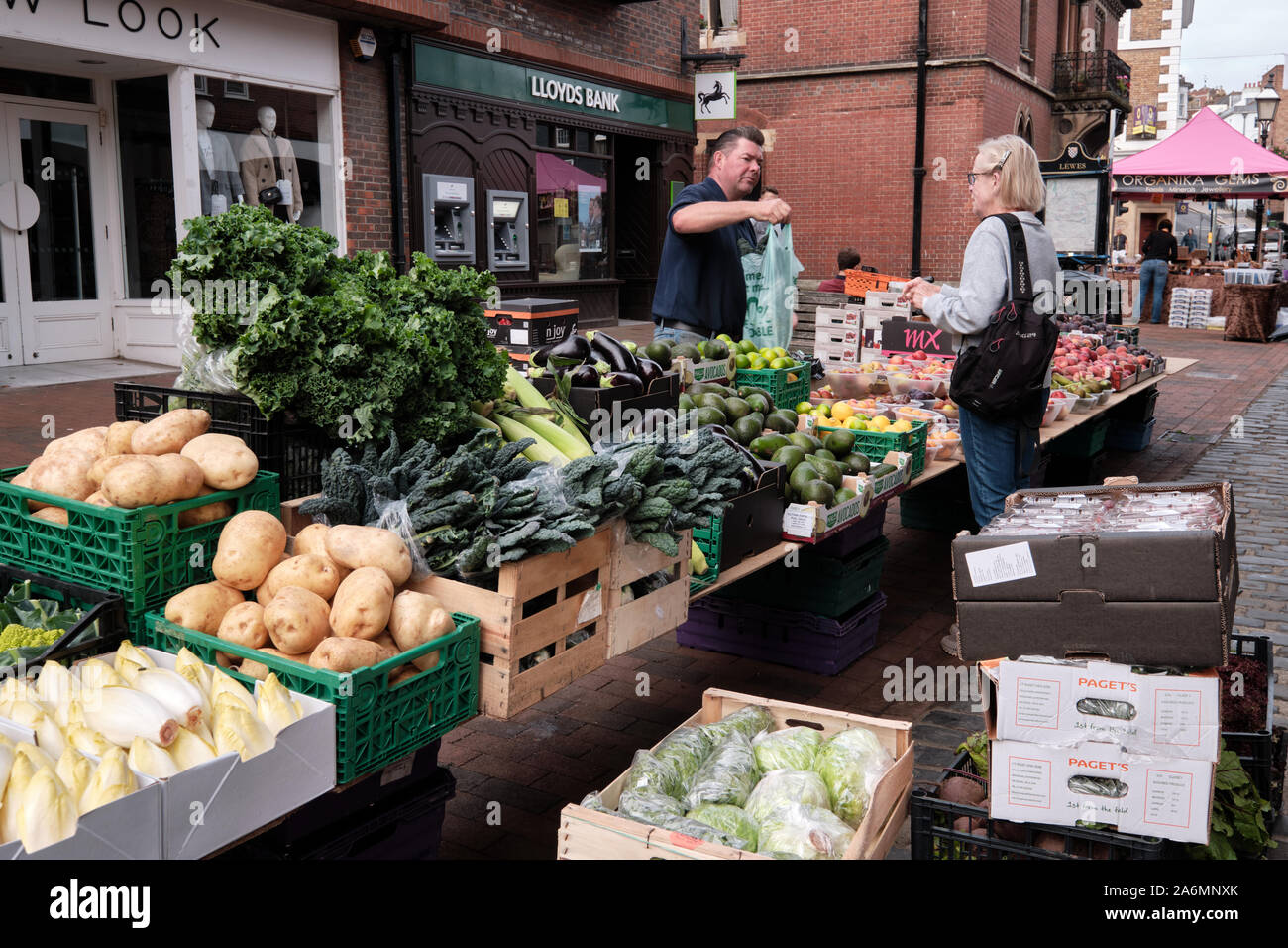 Customer purchasing fruit and vegetables from a street stand set up in centre of pedestrian street in Lewes, East, Sussex, September 13, 2019 Stock Photo