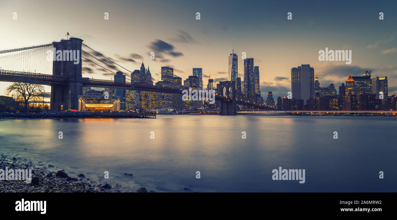 Brooklyn bridge East river and Manhattan at dusk Stock Photo - Alamy