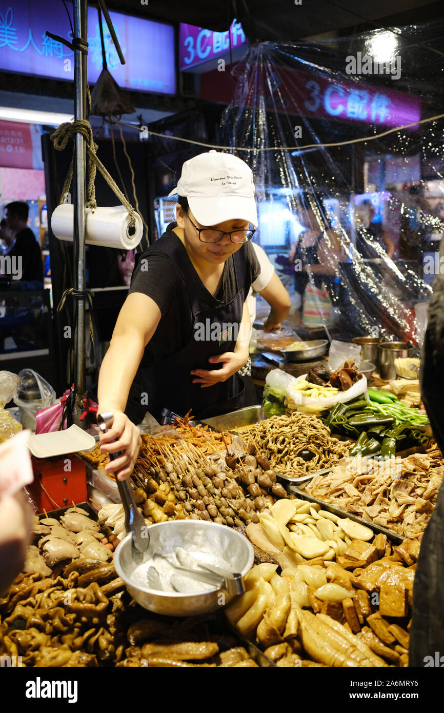 Food stall at Raohe Street Night Market, one of the oldest night markets in Taipei. Stock Photo