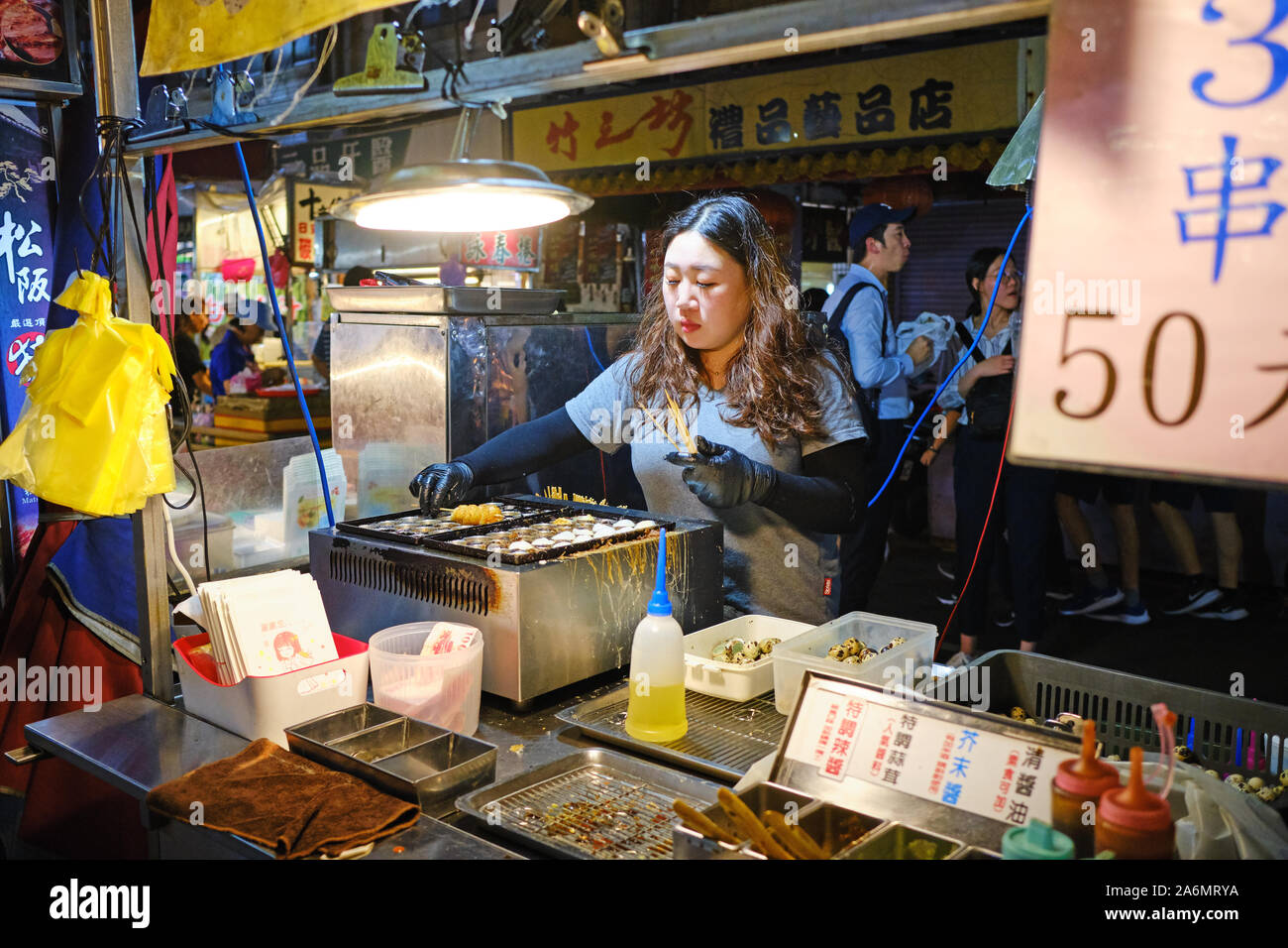 Food stall at Raohe Street Night Market, one of the oldest night markets in Taipei. Stock Photo