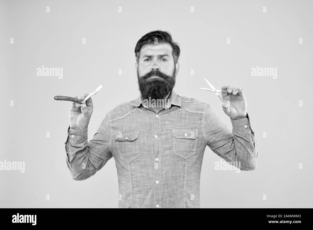 Beard and mustache. Hipster with long beard and mustache hair yellow background. Bearded man