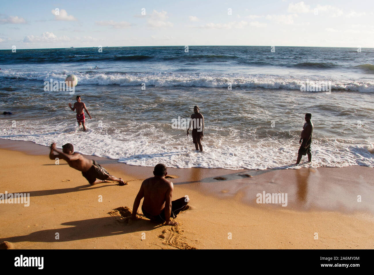 Men playing beach volleyball at Mount Lavinia beach, Colombo, Sri Lanka