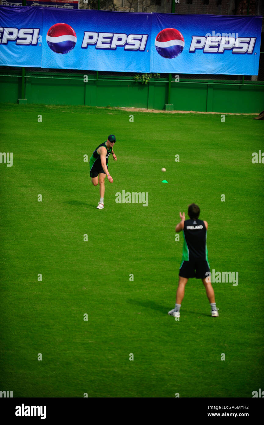 The Irish cricket team practices at the outer field of Sher-e-Bangla National Stadium, in Mirpur, ahead of their match against Bangladesh on 25th February 2011. Dhaka, Bangladesh. February 23, 2011. Stock Photo