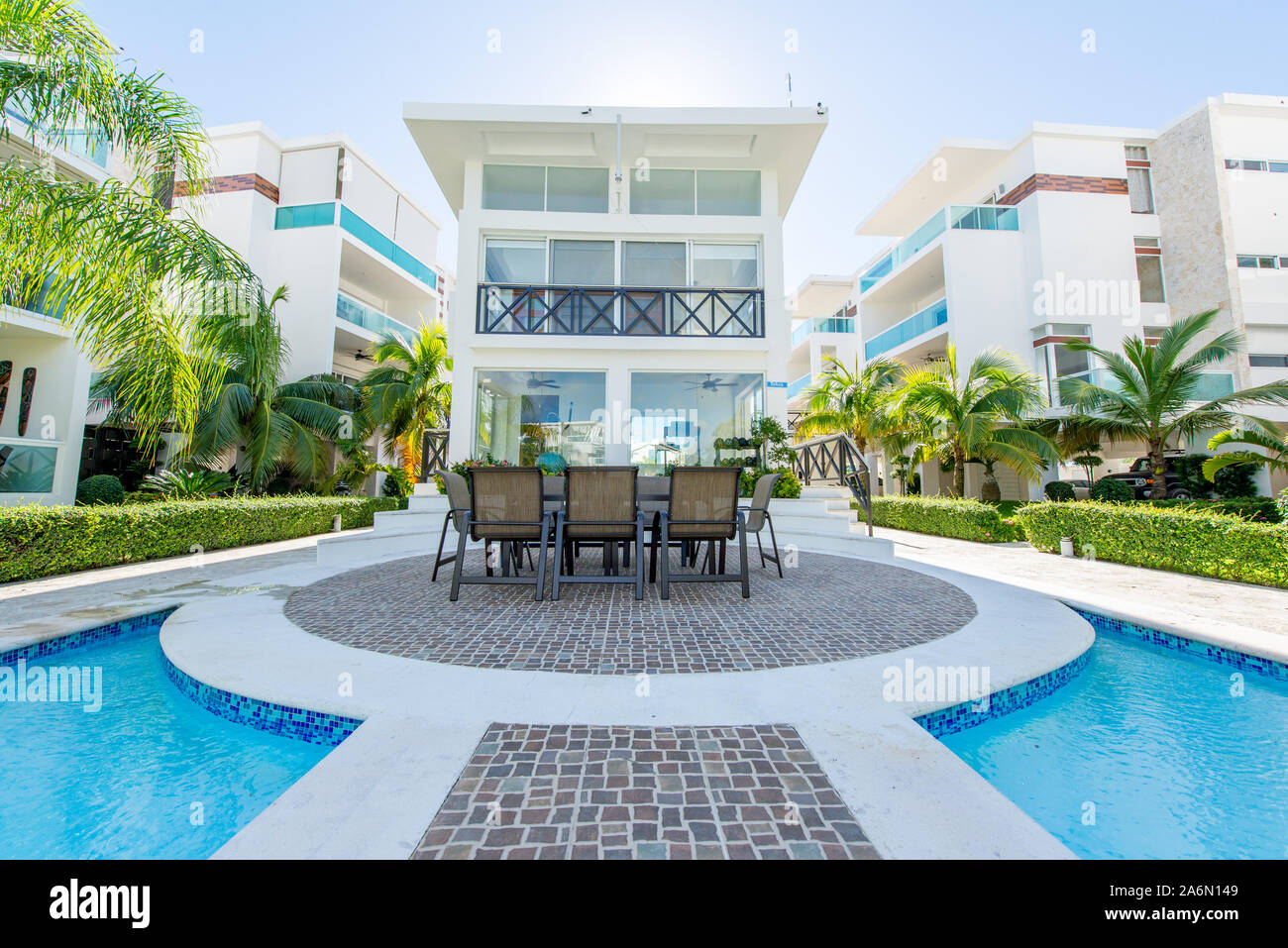 Punta Cana, La Altagracia / Dominican Republic - April 10 2014: Condominum Resort Looking with Palm Trees and Pools of Rich Strangers Stock Photo