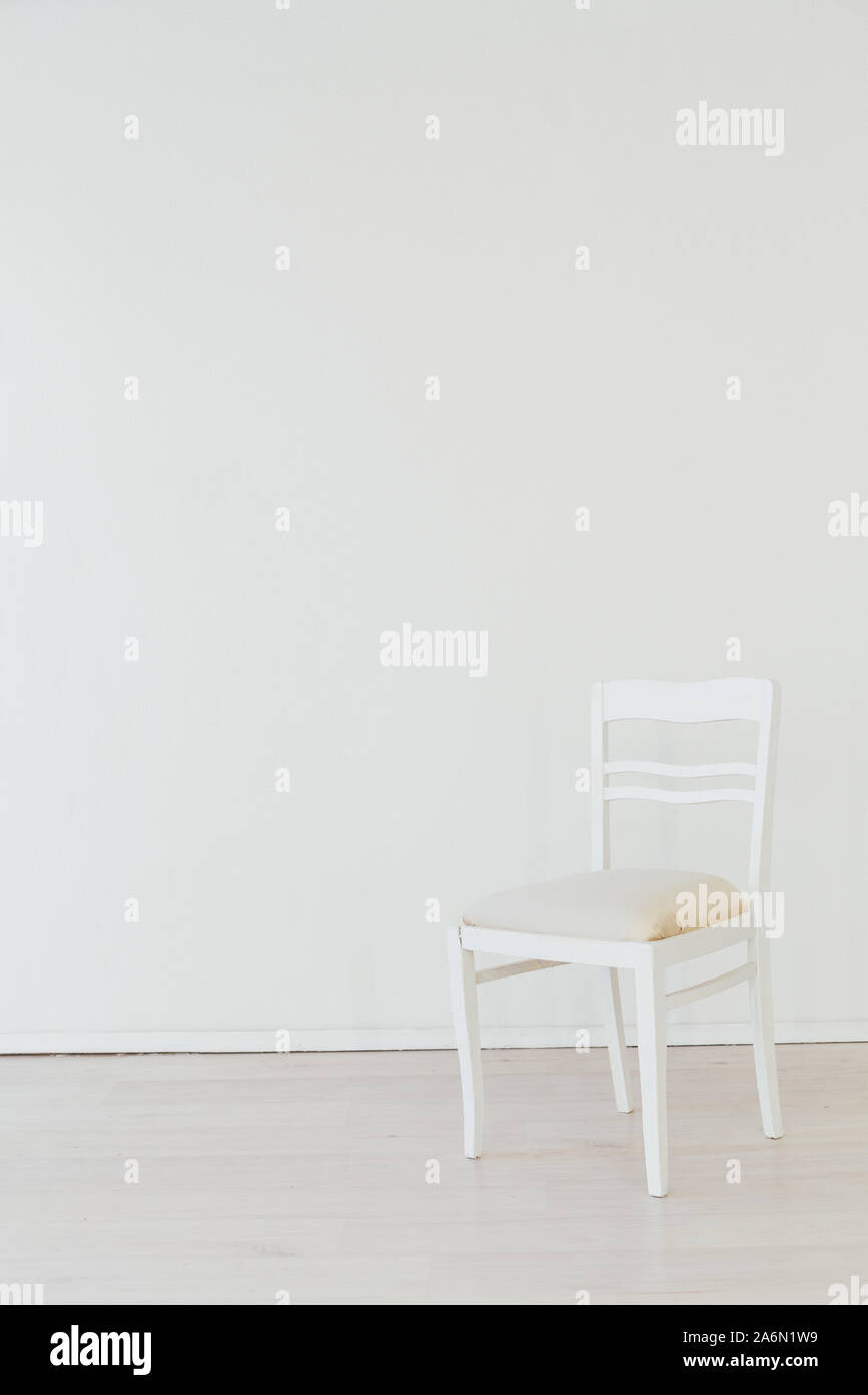 one vintage chair in the interior of the white room Stock Photo - Alamy