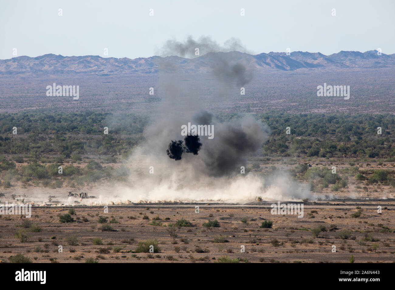 155mm rounds fired from an M777 Howitzer impact during an assault support tactics exercise in support of Weapons and Tactics Instructor (WTI) course 1-20 at Chocolate Mountain Aerial Gunnery Range, California, Oct. 16, 2019. WTI is a seven-week training event hosted by Marine Aviation Weapons and Tactics Squadron One (MAWTS-1), which emphasizes operational integration of the six functions of Marine Corps aviation in support of a Marine Air Ground Task Force. WTI also provides standardized advanced tactical training and certification of unit instructor qualifications to support Marine aviation Stock Photo