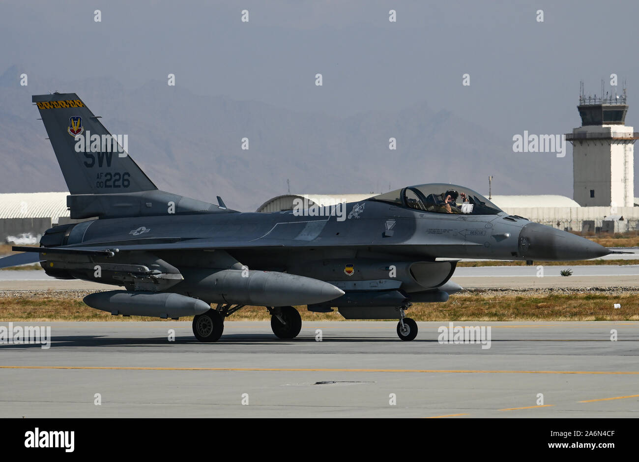 A U.S. Air Force F-16 Fighting Falcon from the 79th Fighter Squadron at Shaw Air Force Base, S.C., arrives at Bagram Airfield, Afghanistan, Oct. 26, 2019. While assigned to the 455th Air Expeditionary Wing at Bagram, the F-16s will help provide decisive airpower through the U.S. Central Command area of responsibility. The airpower the wing provides ensures NATO forces can focus on their mission to train, advise and assist. (U.S. Air Force photo by Staff Sgt. Matthew Lotz) Stock Photo
