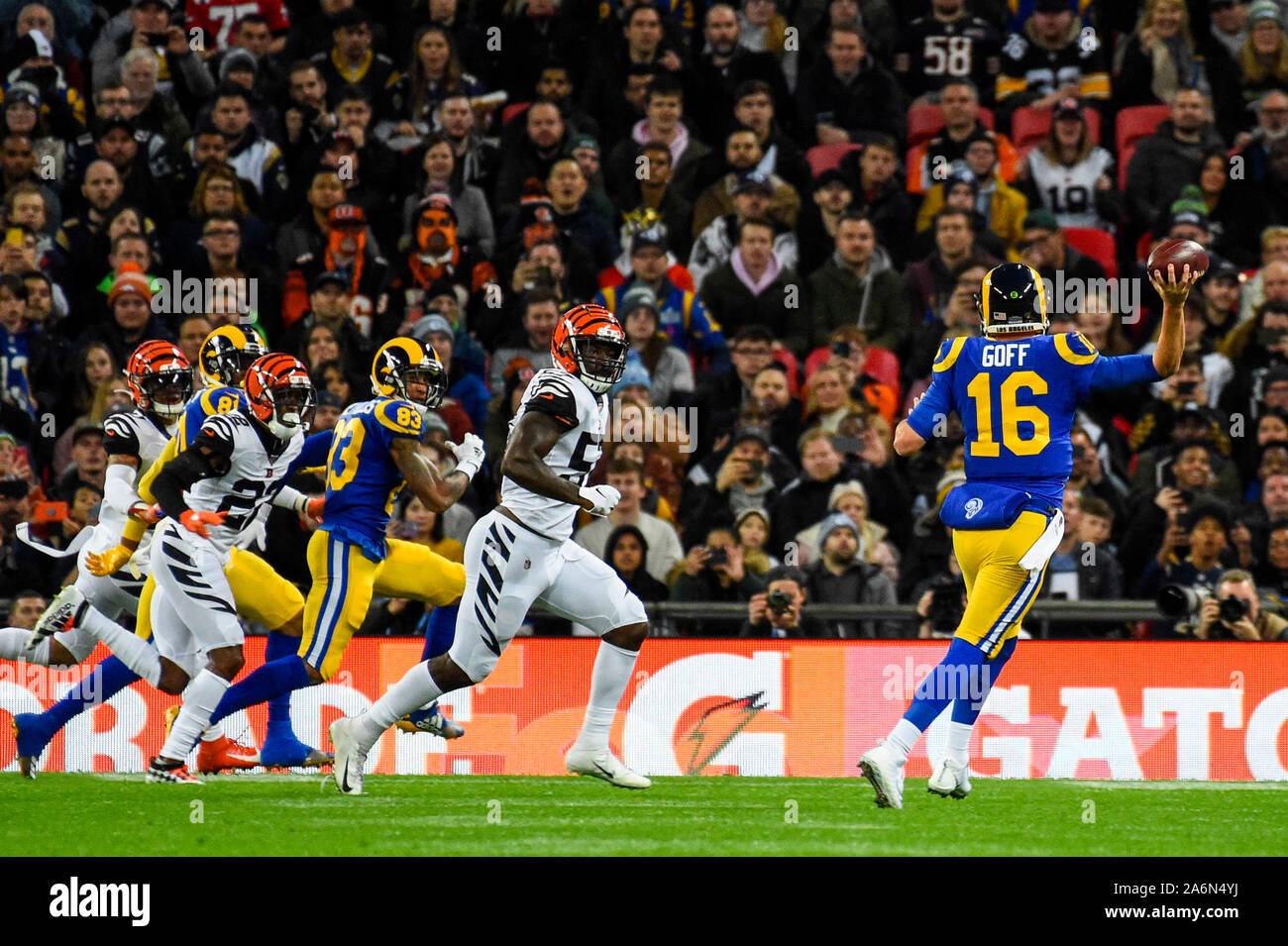 London, UK. 27 October 2019. Rams Quarterback, Jared Goff (16) throws a  pass during the NFL match Cincinnati Bengals v Los Angeles Rams at Wembley  Stadium, game 3 of this year's NFL