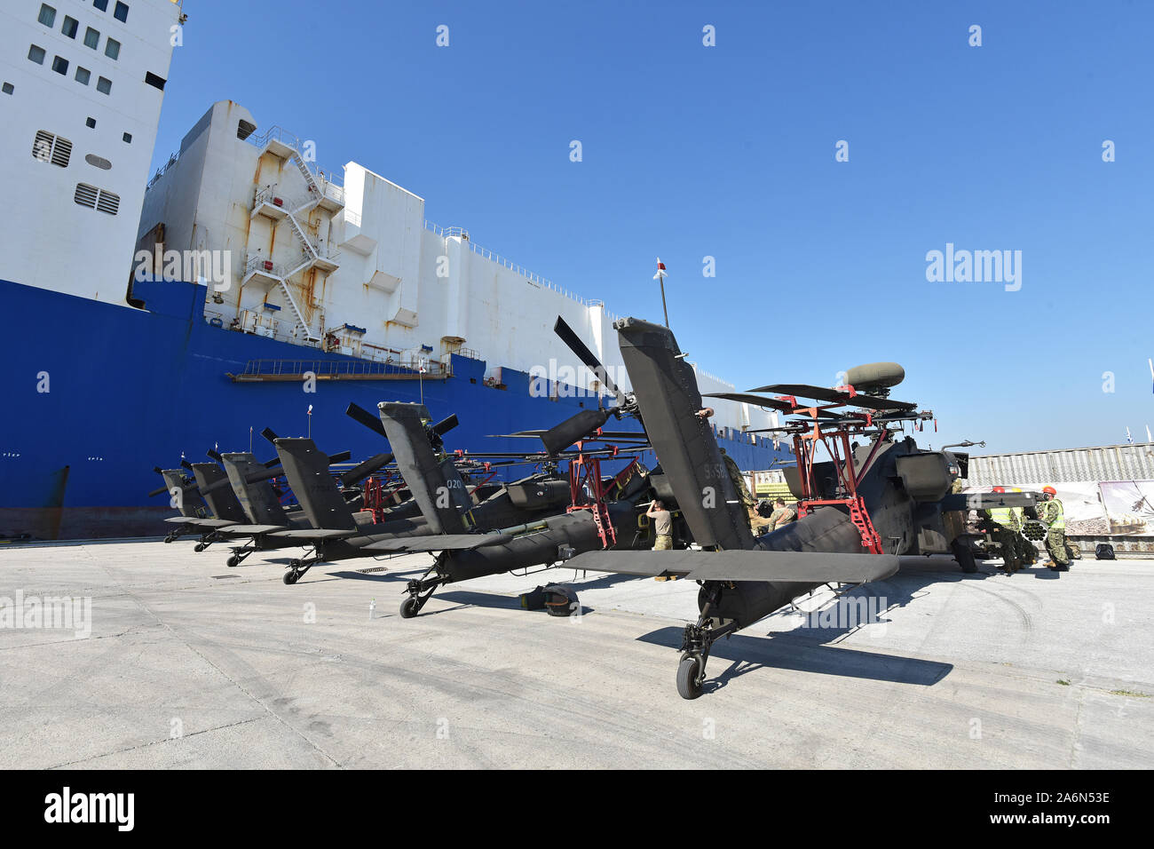 U.S. Army AH-64 Apache helicopters offloaded from the cargo vessel, ARC Endurance, at Volos Port, Greece Oct 26, 2019. The offload occurred during the 3rd Combat Aviation Brigade’s deployment (Import) in support of Atlantic Resolve. The aviation brigade was met by several units to include the 21st Theater Sustainment Command, 598th Transportation Brigade, 839th Transportation Battalion and host-nation partners who coordinated port operations to ensure 3CAB’s successful arrival and preparation for onward movement into the European theater. 3CAB will play a critical role in Atlantic Resolve by t Stock Photo