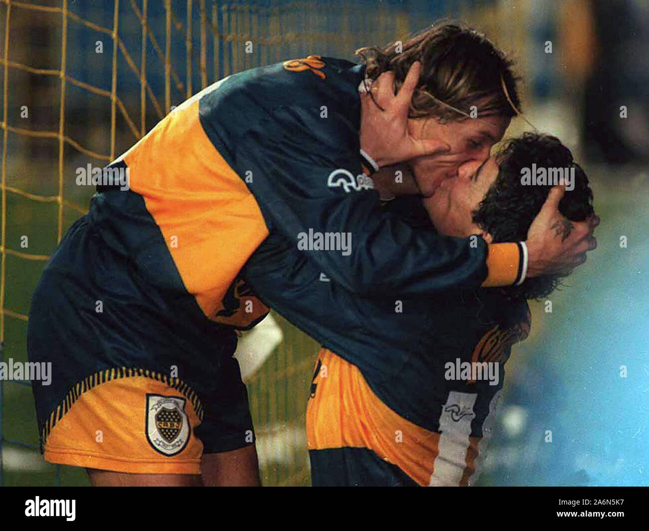 Diego Maradona and Claudio Paul Caniggia kissing after a goal, against River Plate, in the Bombonera Stadium Stock Photo
