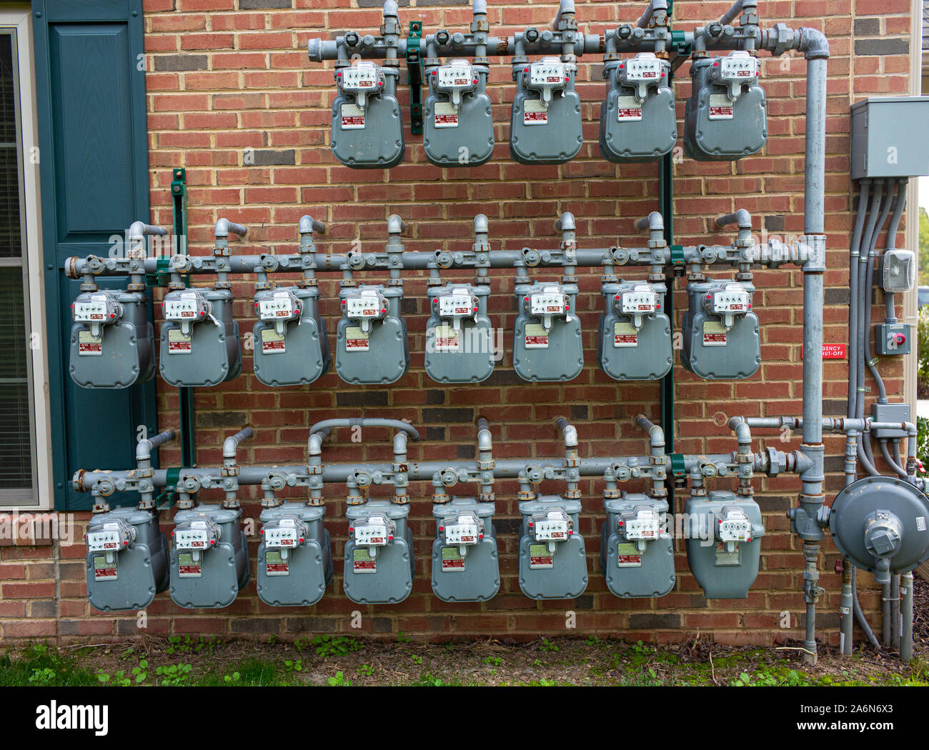 Natural gas meters are fixed to the outside of residential townhouses