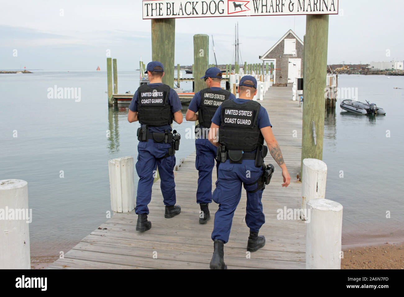 United States Coast Guard officers at Black Dog Wharf, Vineyard Haven, Martha’s Vineyard, Massachusetts, USA Stock Photo