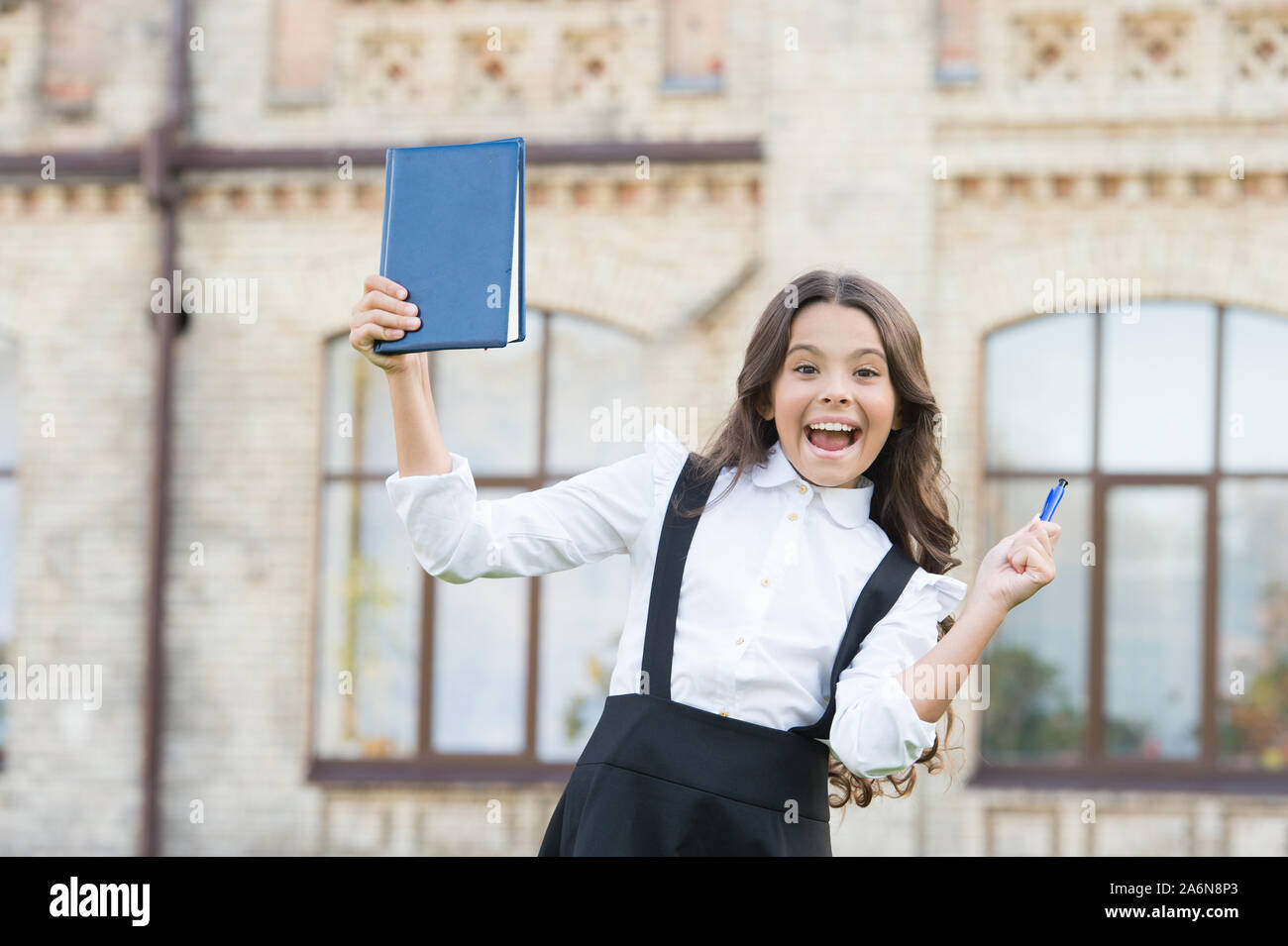 She did it. Happy schoolchild celebrate passing examination. Small