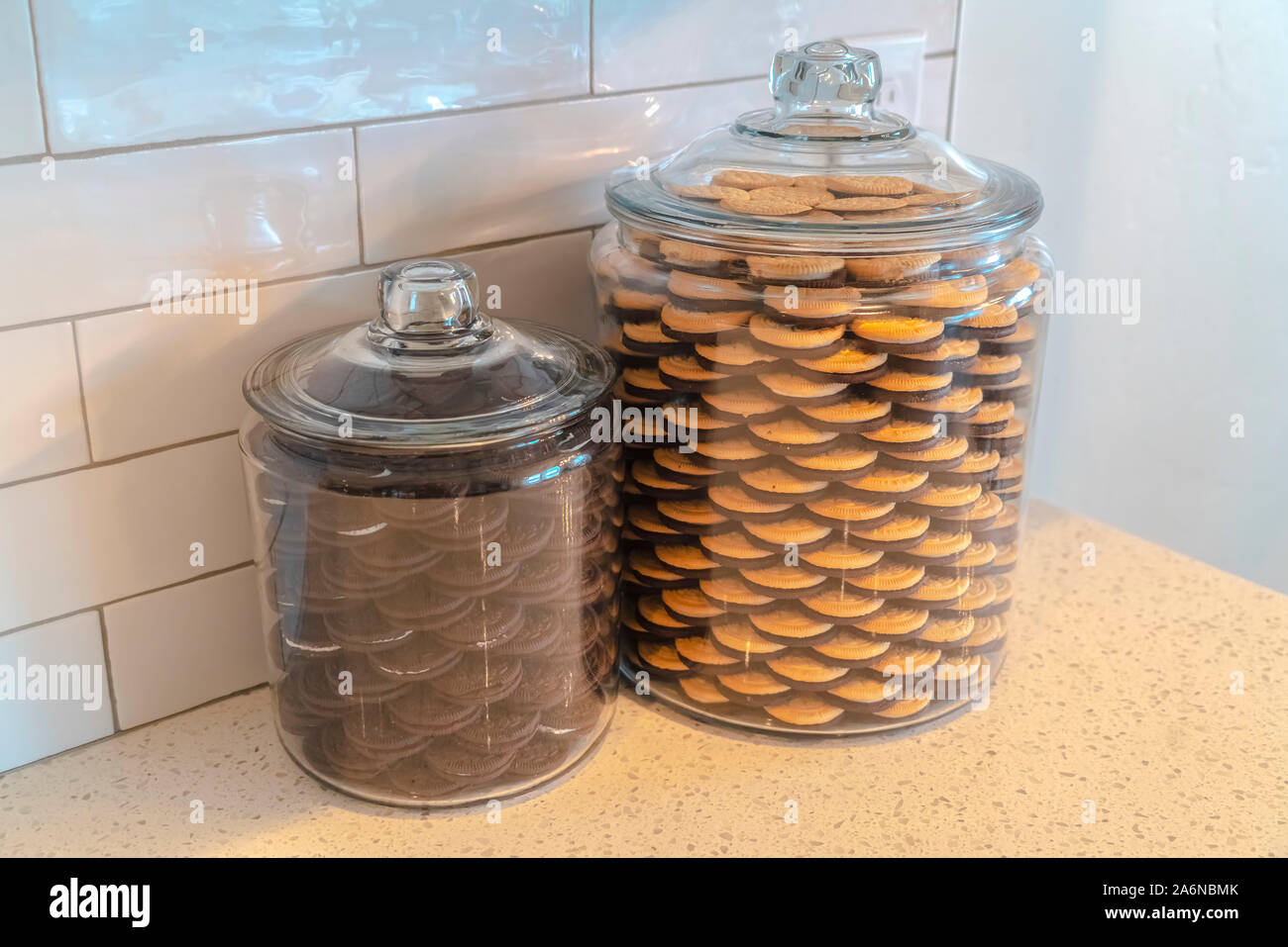 Glass storage jars filled with cookies in kitchen Stock Photo - Alamy