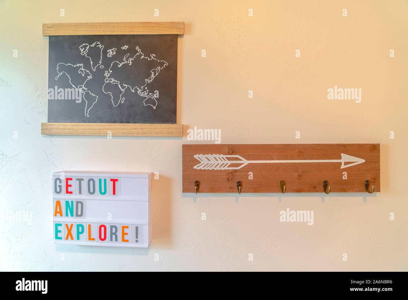 Inspirational wall coat rack and map of the world Stock Photo Alamy