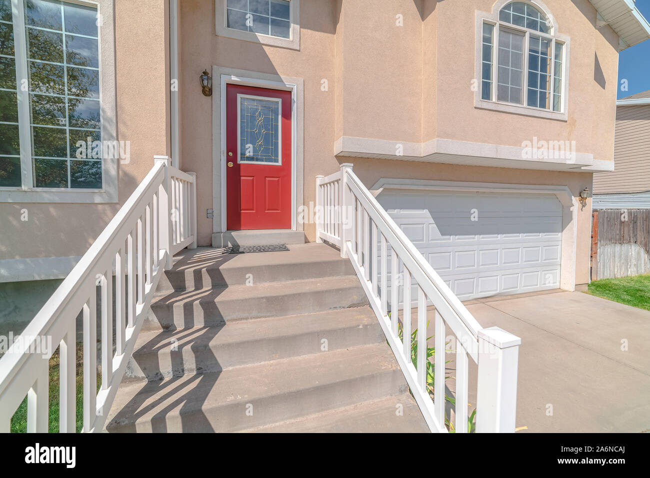 Front door and steps of traditional, modern home Stock Photo Alamy