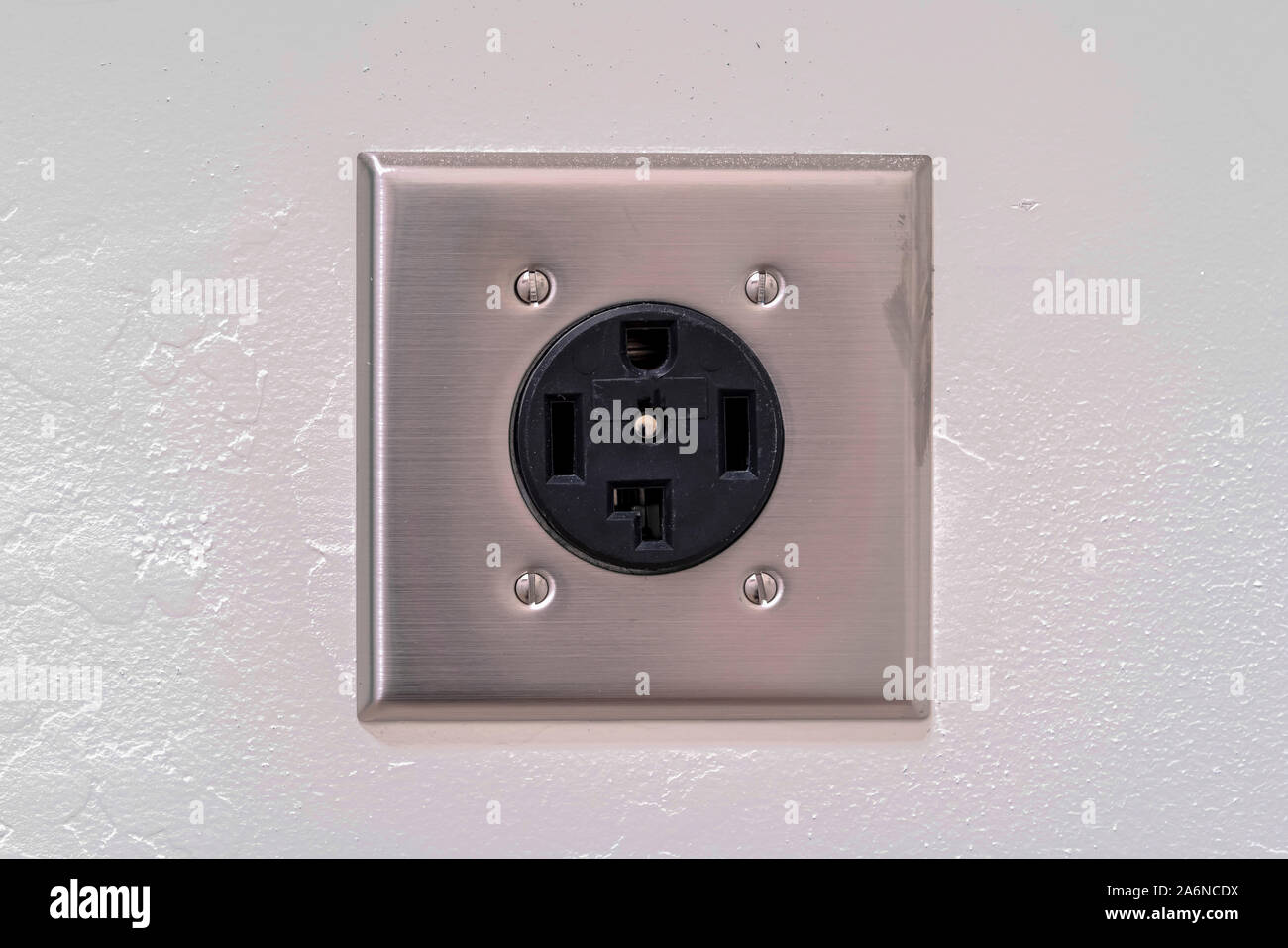 Close up detail of a washing machine plug socket Stock Photo