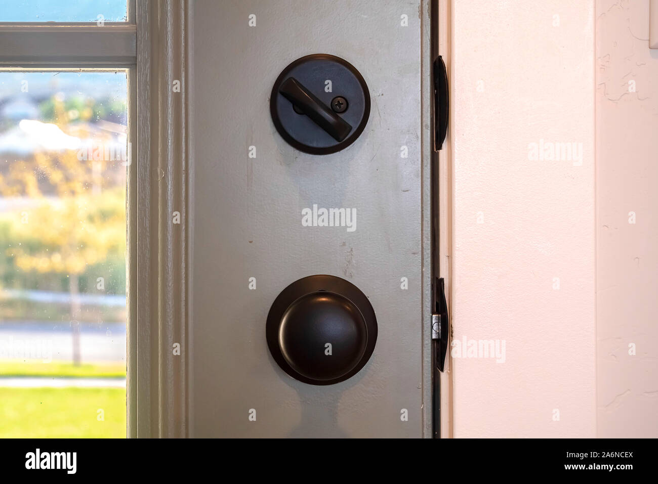 Close up of black door knob and unlocked latch Stock Photo Alamy