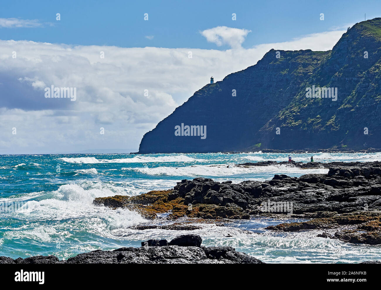 Windward Oahu shoreline and surf breaking over rocks at makapuu Stock Photo