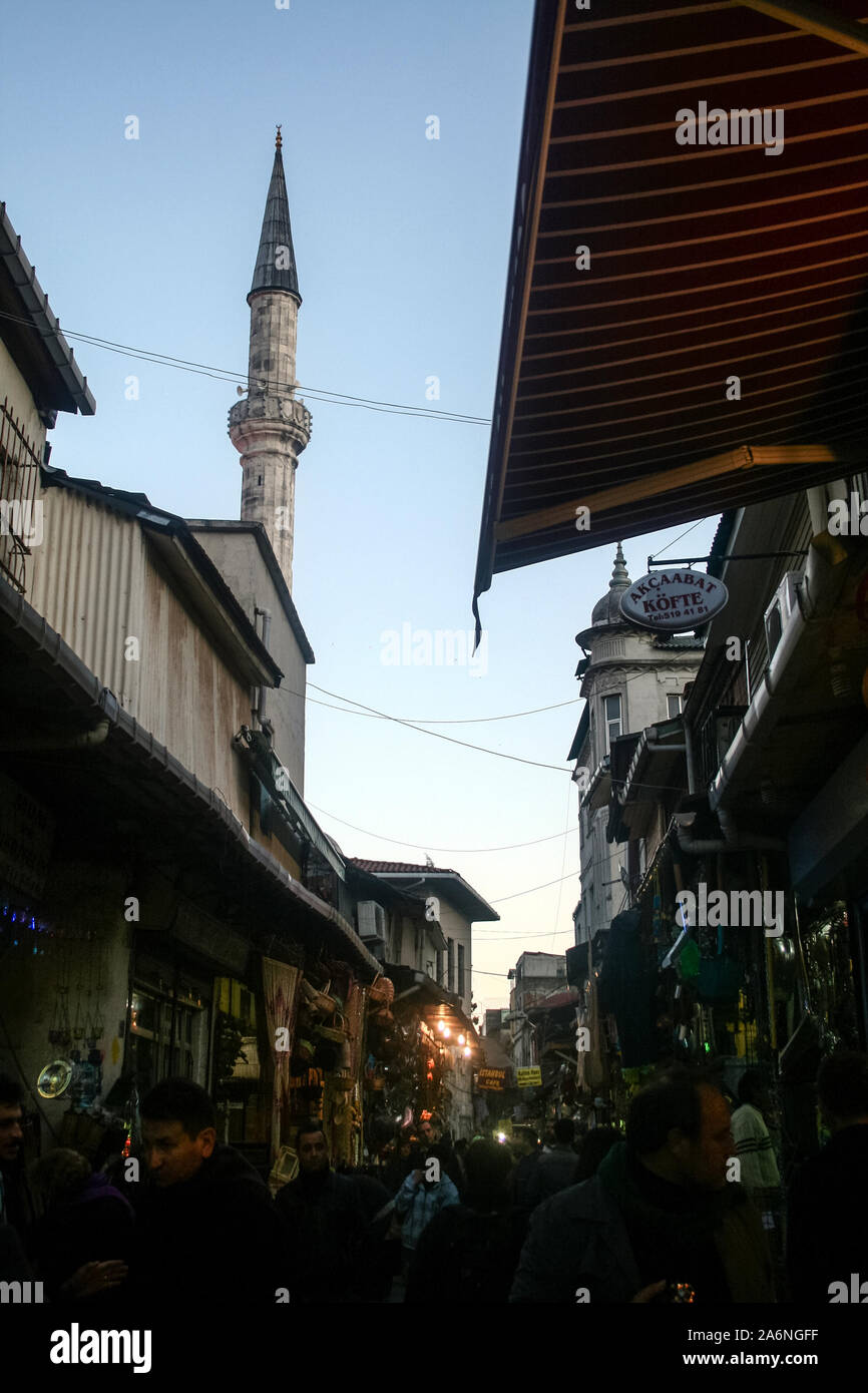 ISTANBUL, TURKEY - DECEMBER 29, 2009: Picture of Hasircilar Street at rush hour, heavily crowded, near the Egyptian bazaar, aka Spice Market, with a m Stock Photo