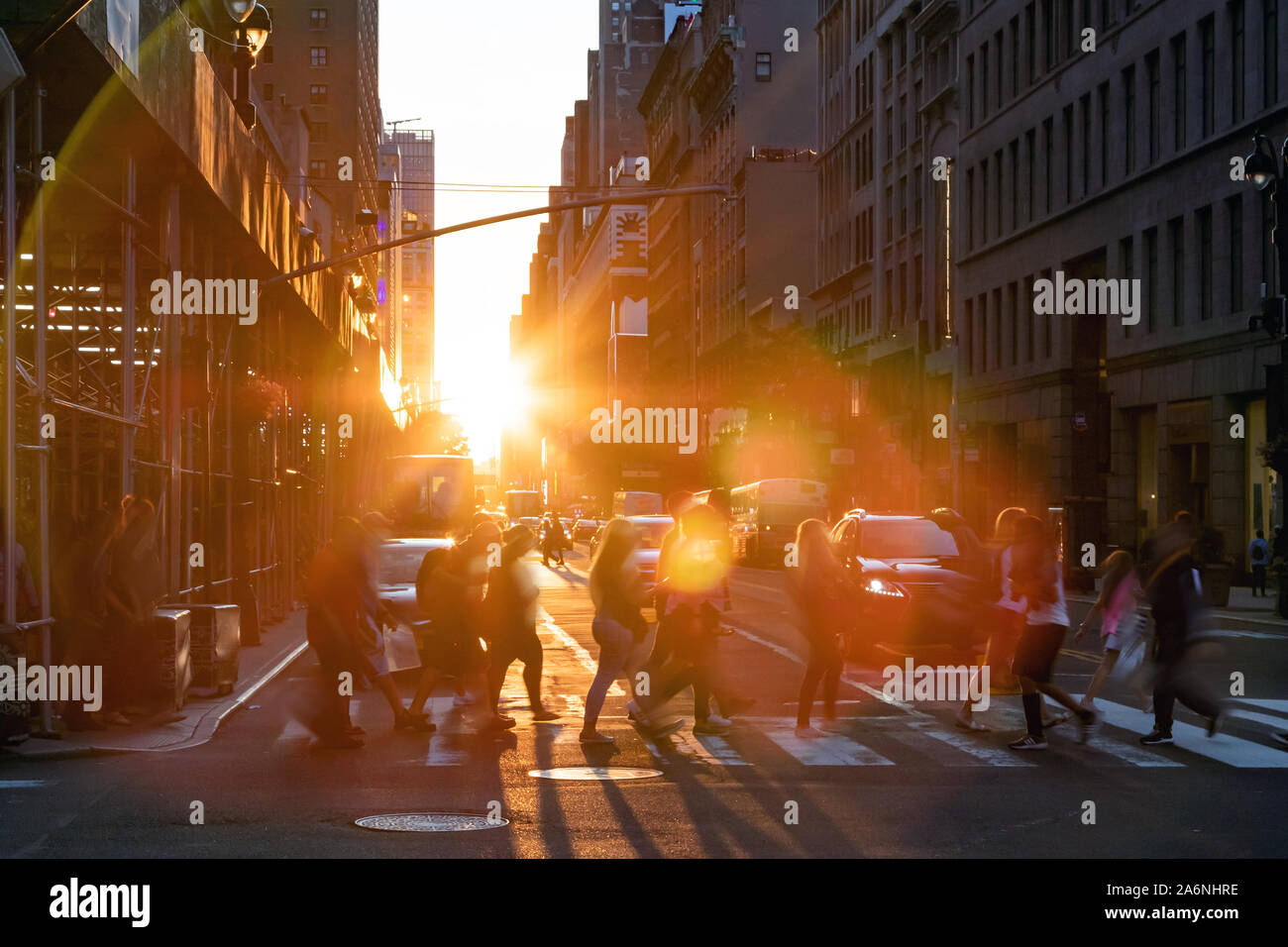 New York City - Crowds of people walking across the busy intersection ...
