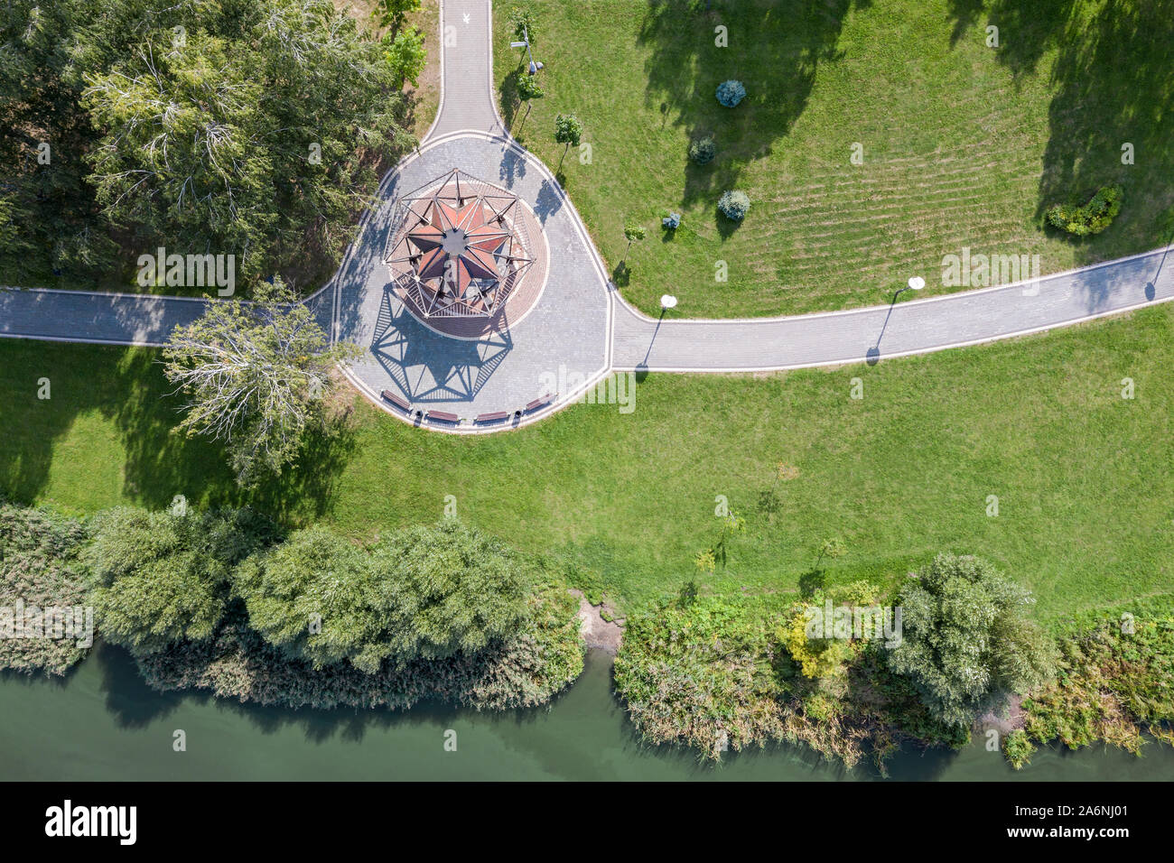 aerial top view of green city park with lawns, arbours for leisure and ...
