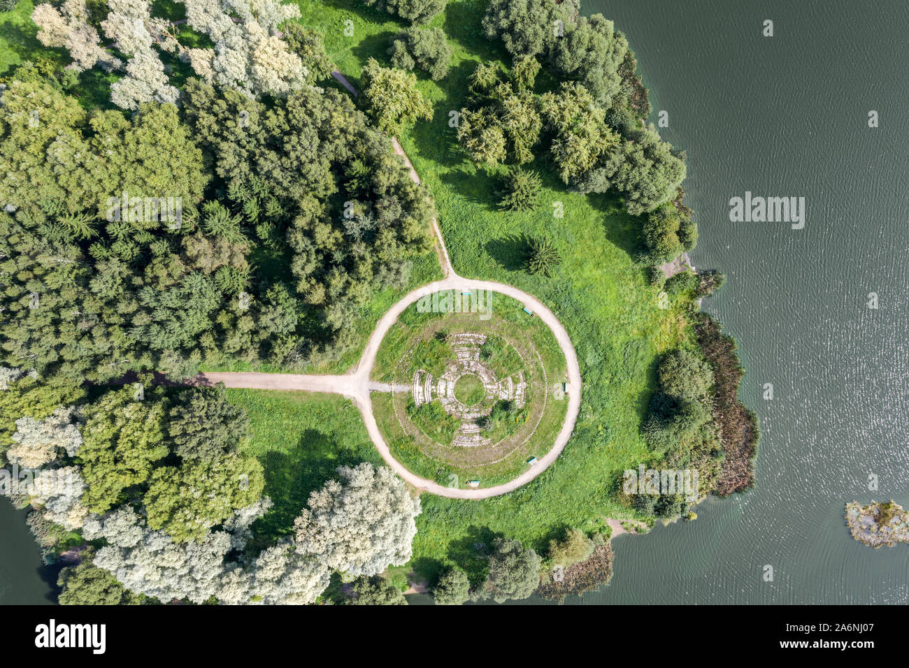 aerial top view of summer park with green bushy trees and water pond ...