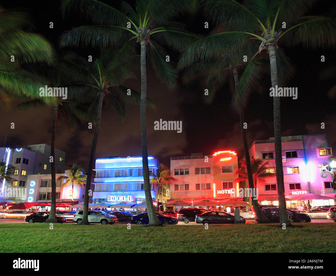 Colorful illuminated hotels on Ocean Drives at night, Miami Beach Stock Photo