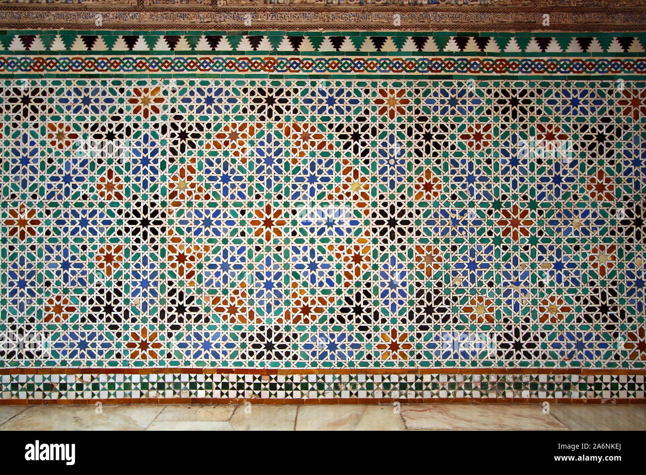Alicatado geometric tiling wall in the Alhambra palace, Granada, Andalusia, Spain Stock Photo