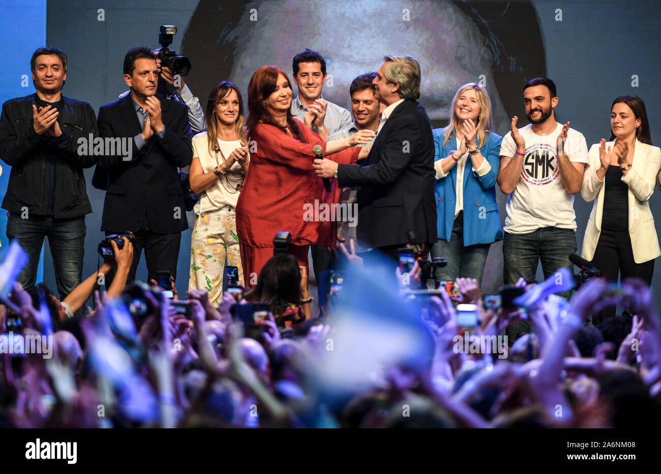 Buenos Aires, Argentina. 27th Oct, 2019. Alberto Fernandez (center r), presidential candidate of the Peronists, and Cristina Fernandez de Kirchner (center l), former president of Argentina, wave to their supporters after the election. Opposition candidate Fernandez has won the presidential election in Argentina. Macri's direct predecessor Cristina Kirchner, who had governed from 2007 to 2015, will be the new Vice President. Credit: Fernando Gens/dpa/Alamy Live News Stock Photo
