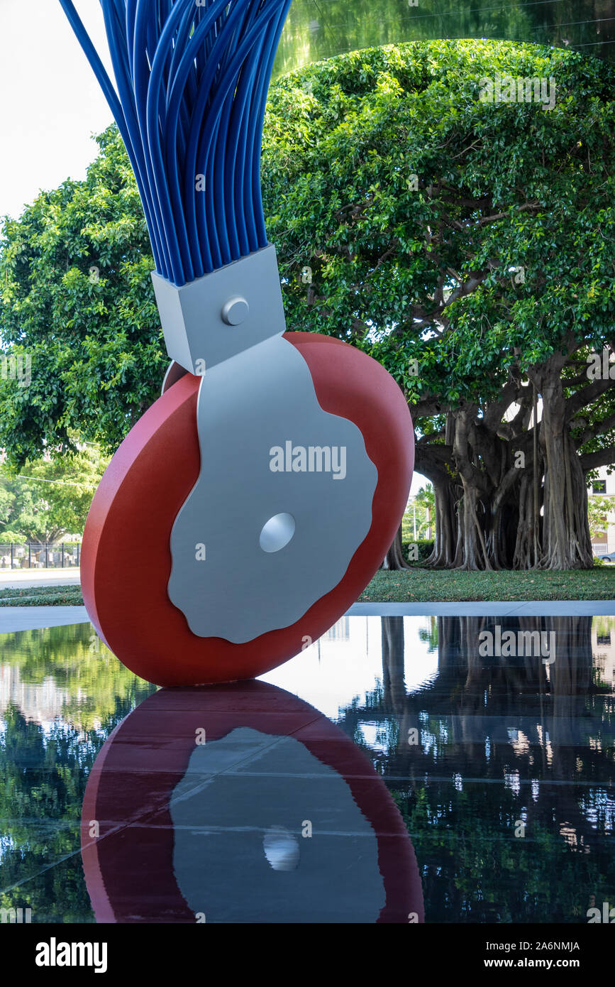 Pop art sculpture Typewriter Eraser Scale X on the reflecting pool at the entrance to the Norton Museum of Art in West Palm Beach, Florida. (USA) Stock Photo