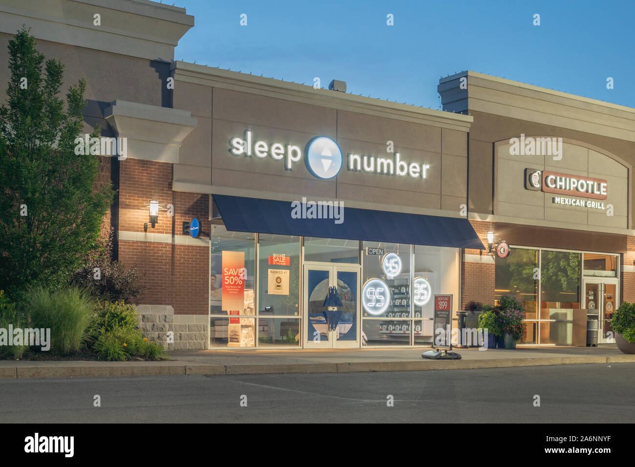 New Hartford, New York - Aug 18, 2019: Night View of Sleep Number Store, It is a U.S.-based Manufacturer Produces the Sleep Number Branded Mattresses, Stock Photo