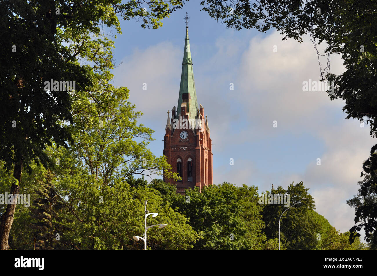 A tall church steeple in historic Latvia, Lithuania Stock Photo