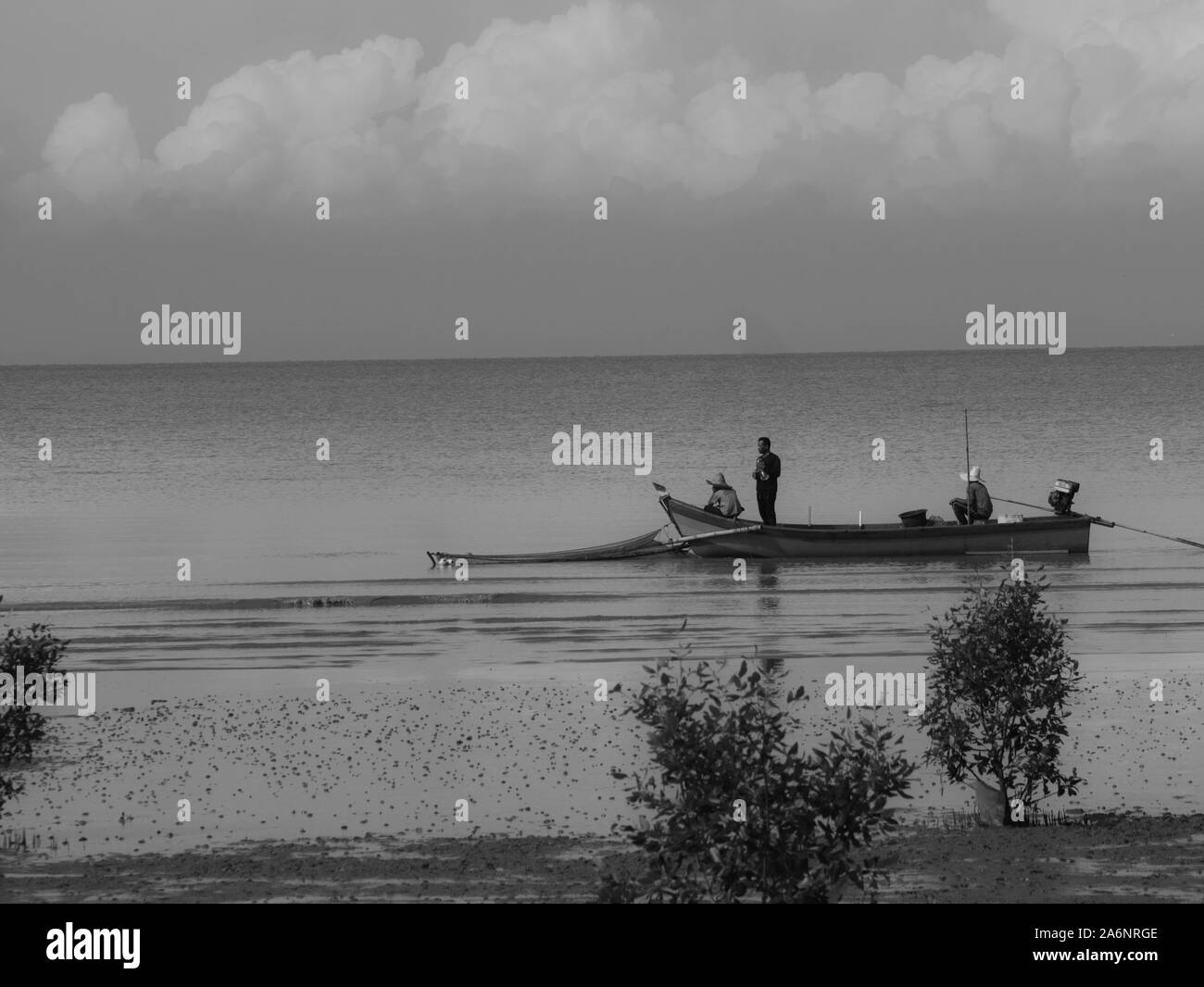 Fishing boat fishermen evening Black and White Stock Photos & Images ...