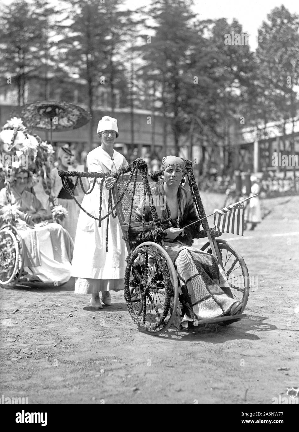 Wounded WW I soldiers at Walter Reed Hospital participate in a 4th of July wheel chair parade ca. 1919 Stock Photo