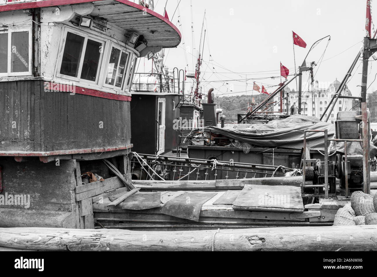 Partially desaturated view of beautiful chinese boats in Dalian Harbor Stock Photo