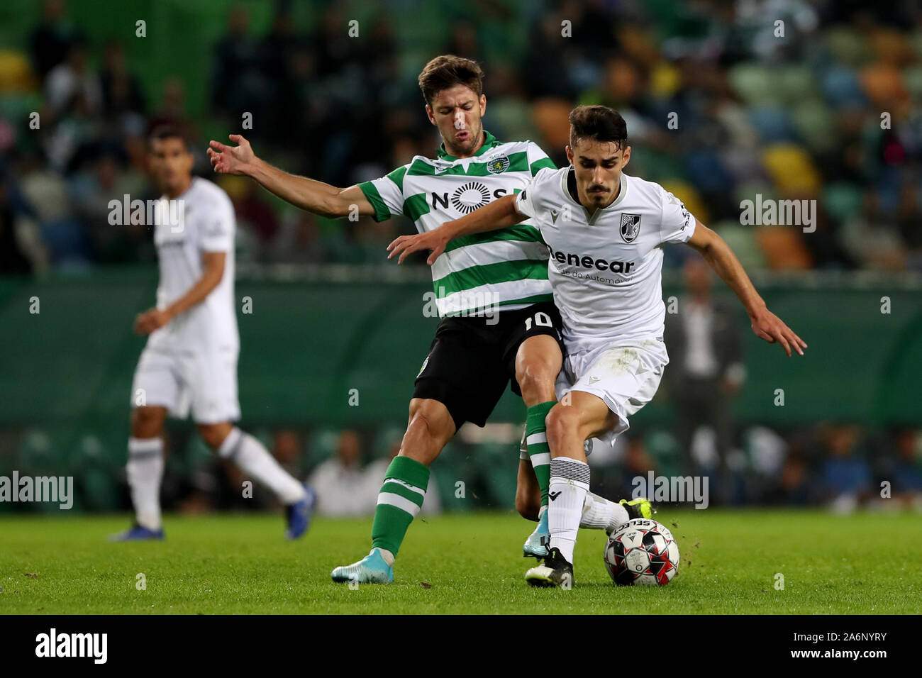 Lisbon, Portugal. 27th Oct, 2019. Andre Almeida (R) of Vitoria Guimaraes vies with Luciano Vietto of Sporting CP during the Portuguese League football match in Lisbon, Portugal, Oct. 27, 2019. Credit: Pedro Fiuza/Xinhua/Alamy Live News Stock Photo