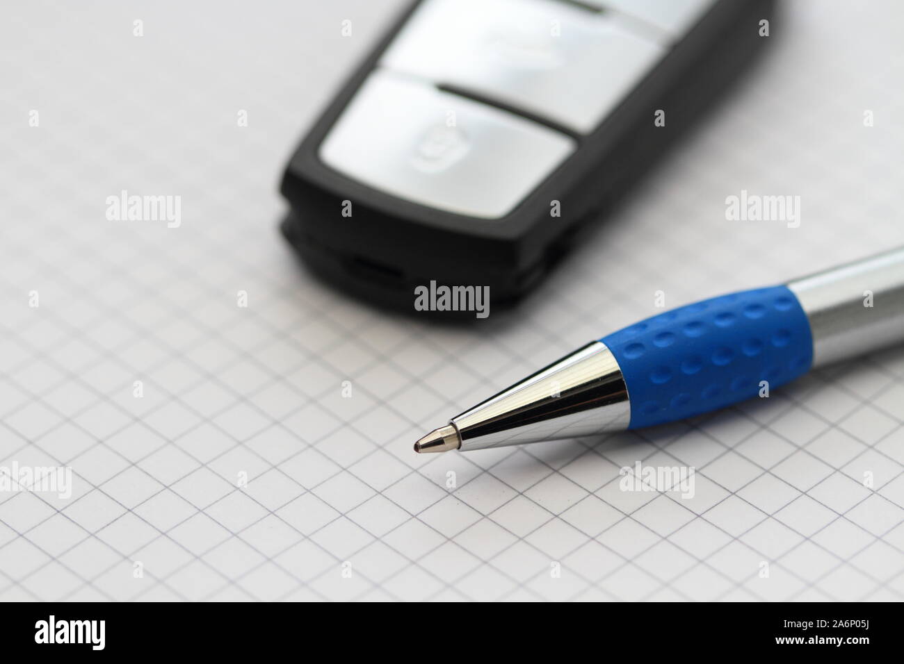 Paper Car Key a car key and pen on a blank sheet of paper Stock Photo - Alamy