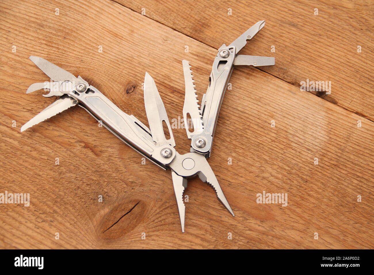 a multitool on the workbench Stock Photo