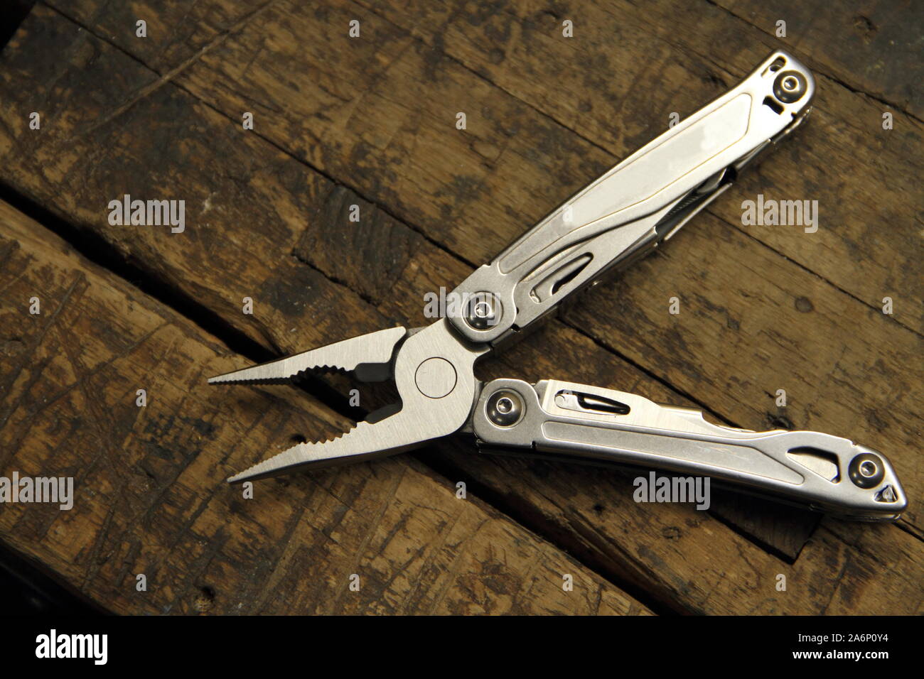 a multitool on the workbench Stock Photo